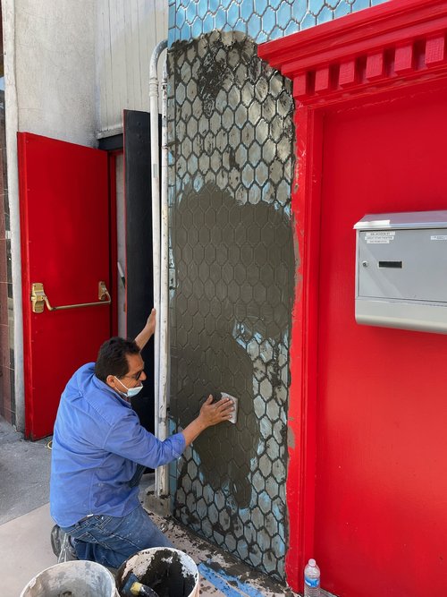 Restoring the tiles on the facade