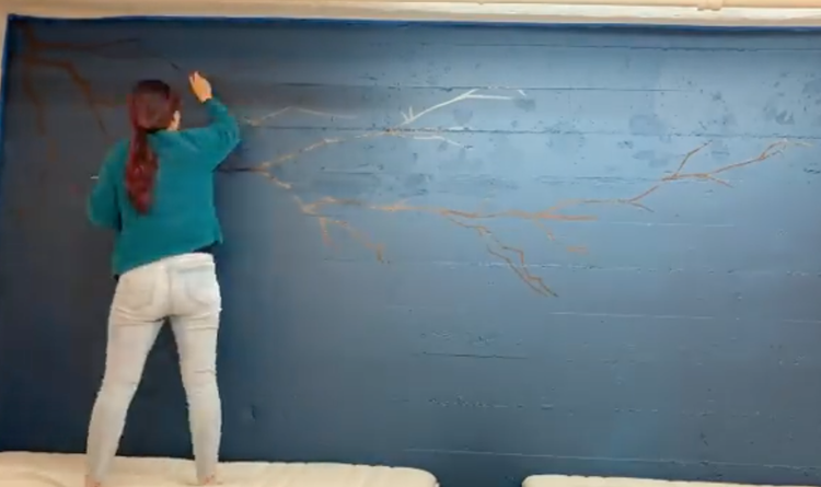 Alice Chu painting the mural